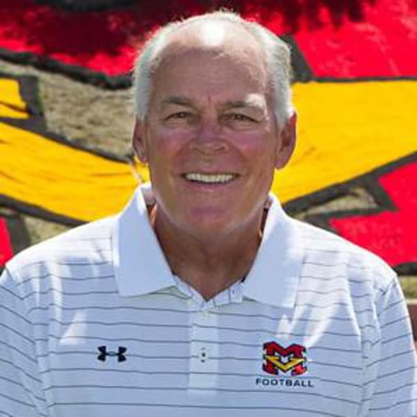 Coach Bob Johnson in front of Diablos mural